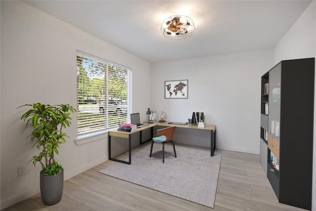 office area with light hardwood / wood-style flooring