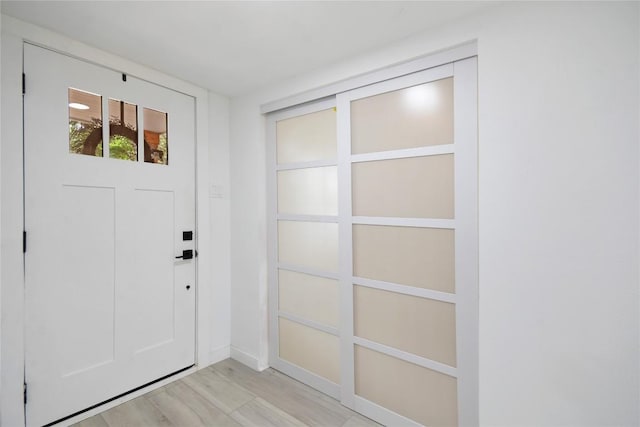 doorway to outside with light hardwood / wood-style floors