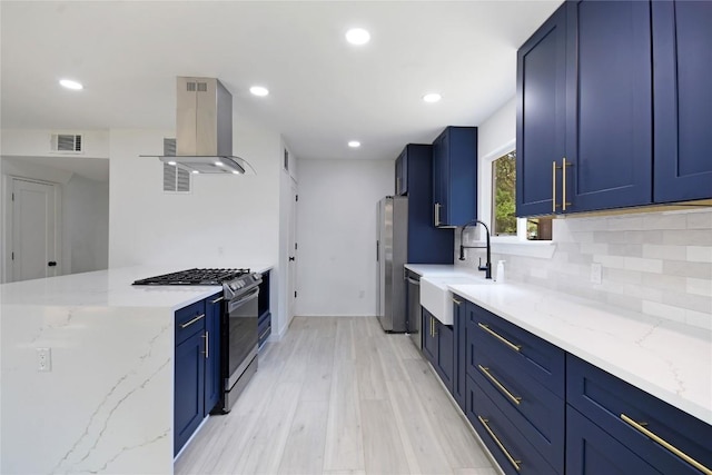 kitchen with stainless steel appliances, light stone countertops, and island range hood