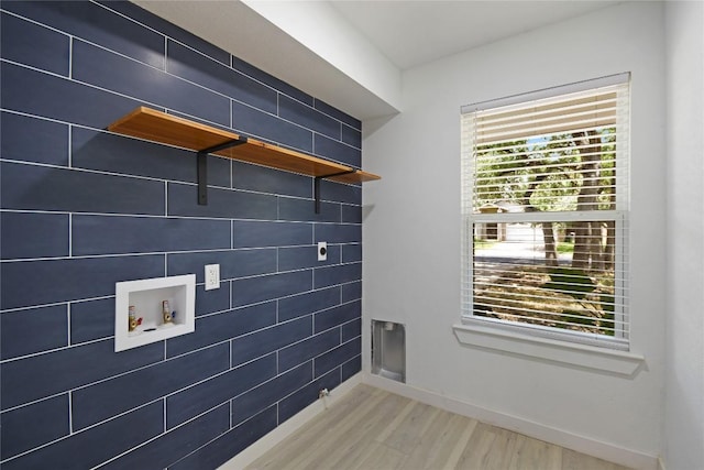 laundry area featuring hardwood / wood-style flooring and hookup for a washing machine