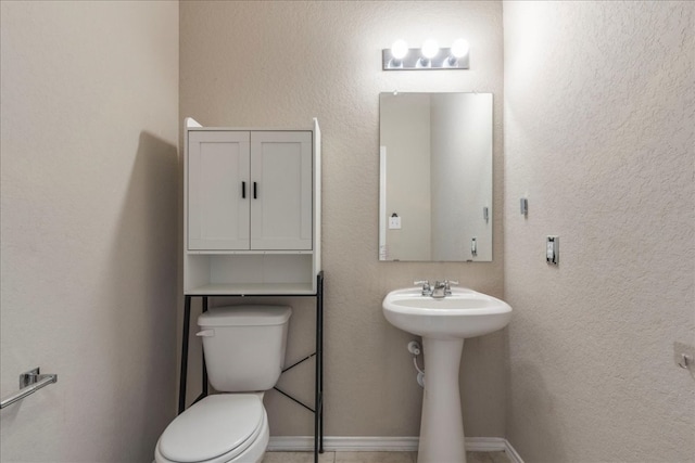 bathroom with sink and toilet