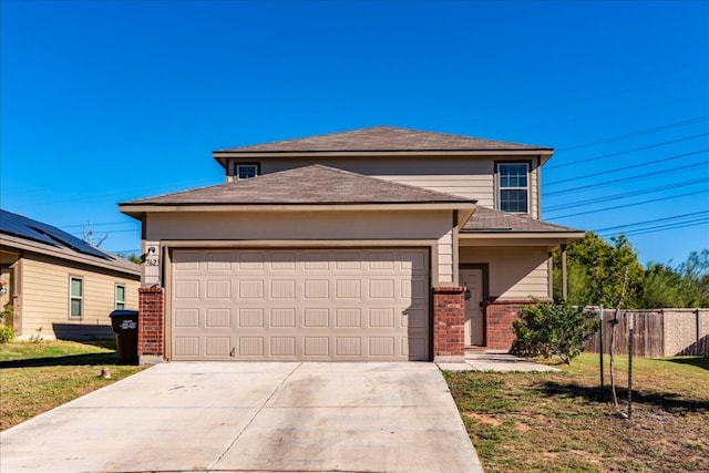 view of front facade with a garage and a front yard