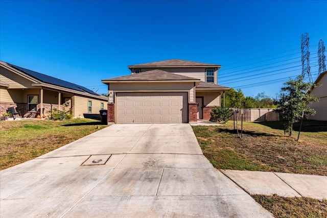 view of front of house featuring a front yard and a garage