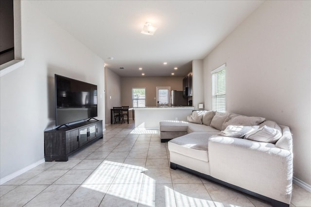 living room with light tile patterned flooring