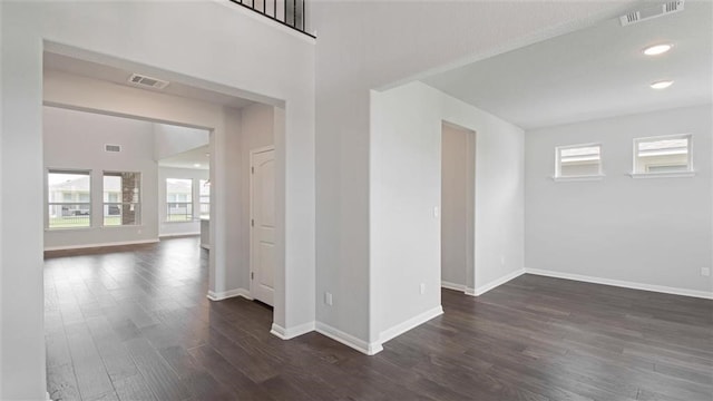 empty room with dark wood-type flooring