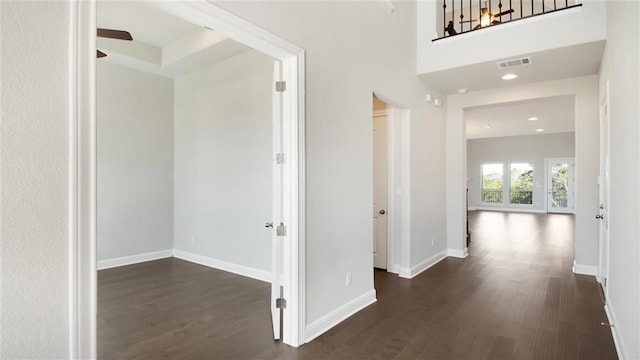 corridor featuring dark hardwood / wood-style flooring