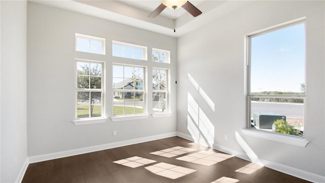 empty room featuring dark hardwood / wood-style floors and ceiling fan