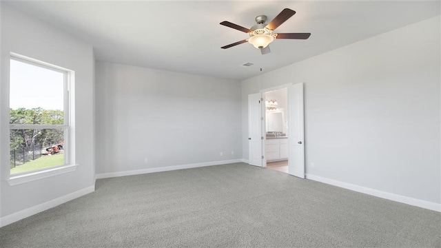 carpeted empty room with ceiling fan