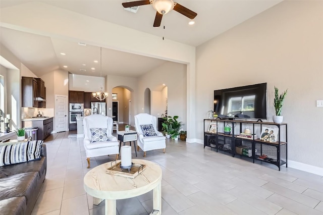 3317 Nighthawk Dive Ln, Pflugerville, TX 78660 - living area featuring arched walkways, a ceiling fan, lofted ceiling, recessed lighting, and a chandelier