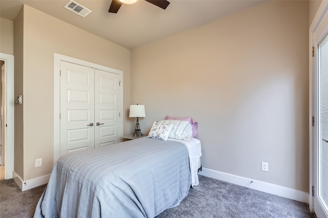 carpeted bedroom with ceiling fan and a closet