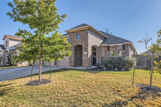 3317 Nighthawk Dive Ln, Pflugerville, TX 78660 - view of front of property with brick siding, concrete driveway, and a garage