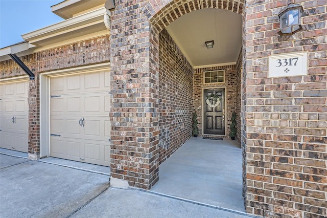 3317 Nighthawk Dive Ln, Pflugerville, TX 78660 - doorway to property with brick siding, a garage, and driveway