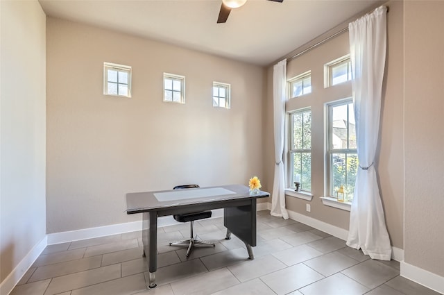 tiled office space featuring ceiling fan