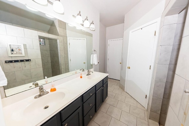 bathroom featuring tile patterned flooring and vanity