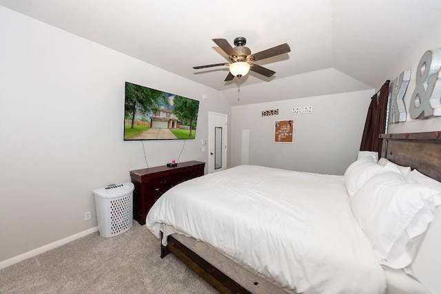 bedroom with lofted ceiling, light carpet, and ceiling fan