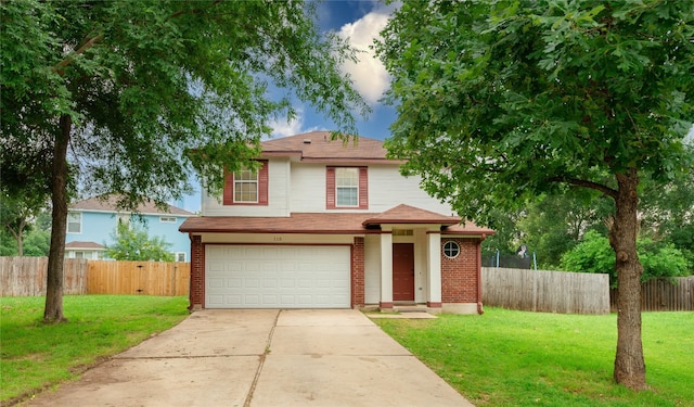 view of front property featuring a garage and a front lawn