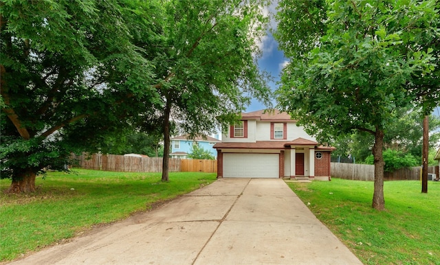 front of property featuring a front lawn and a garage