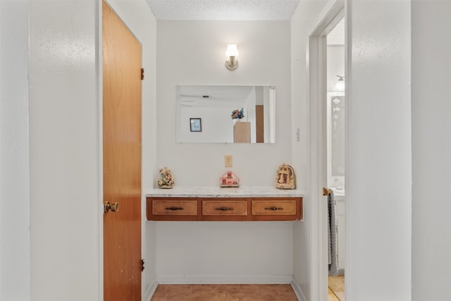 bathroom featuring a textured ceiling