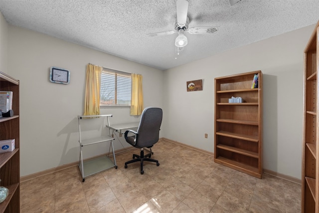 office area with a textured ceiling and ceiling fan