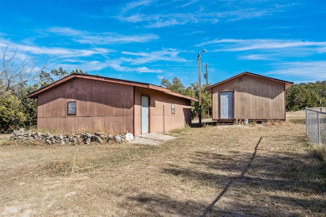 view of side of property featuring an outdoor structure