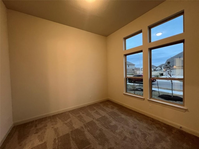 unfurnished room with carpet flooring