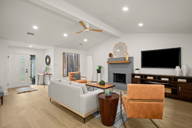 living room featuring light wood-type flooring, lofted ceiling with beams, and ceiling fan