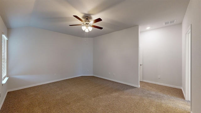 empty room with light carpet, ceiling fan, and lofted ceiling