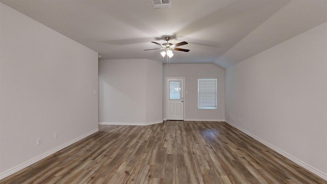 interior space featuring wood finished floors, baseboards, a ceiling fan, and visible vents