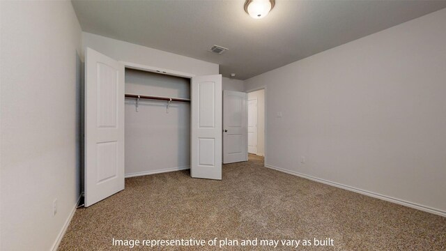 unfurnished bedroom featuring carpet floors and a closet