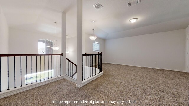 additional living space with carpet flooring, plenty of natural light, lofted ceiling, and a notable chandelier