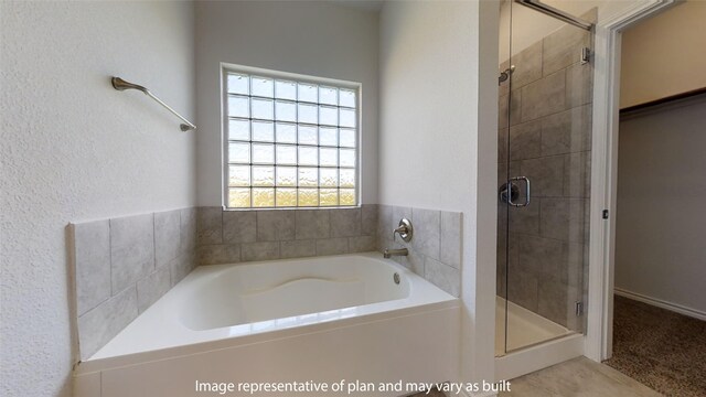 bathroom with shower with separate bathtub