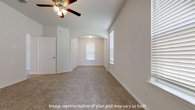 unfurnished room featuring light carpet and ceiling fan