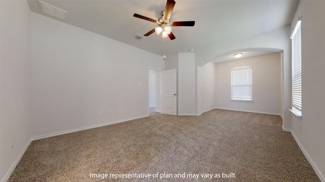 empty room with ceiling fan and carpet