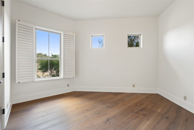 empty room featuring hardwood / wood-style floors