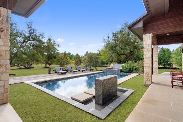 view of pool featuring a patio and a lawn