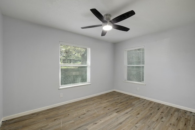 spare room featuring ceiling fan and light wood-type flooring