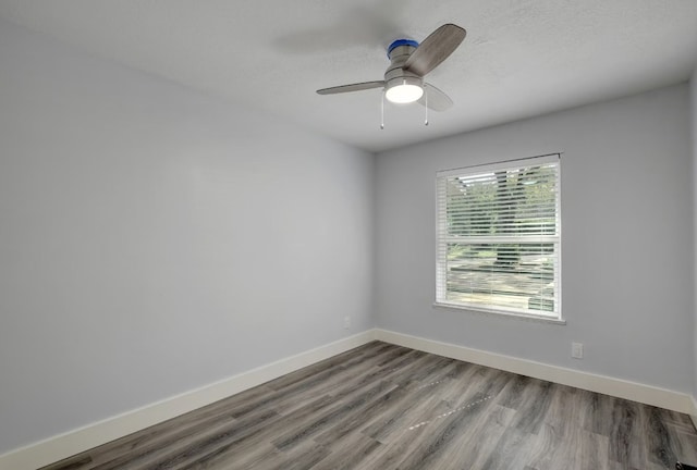 spare room featuring ceiling fan, a textured ceiling, and hardwood / wood-style flooring