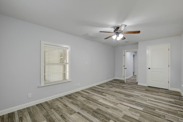 unfurnished bedroom with ceiling fan and light hardwood / wood-style floors