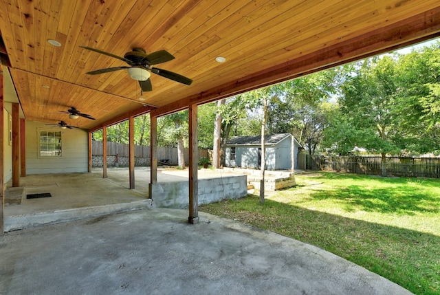 view of patio / terrace with ceiling fan and a storage unit