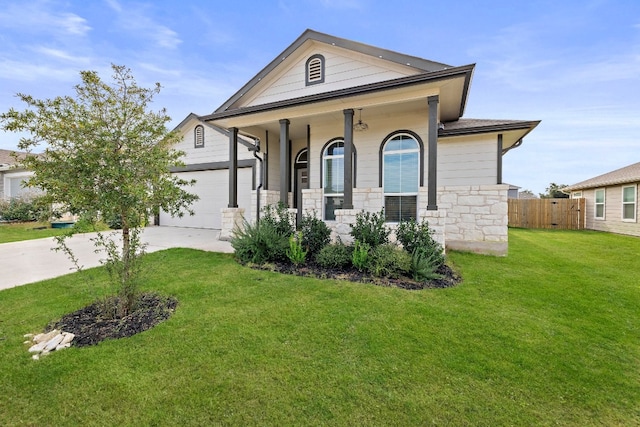 view of front facade with a front lawn, a porch, and a garage