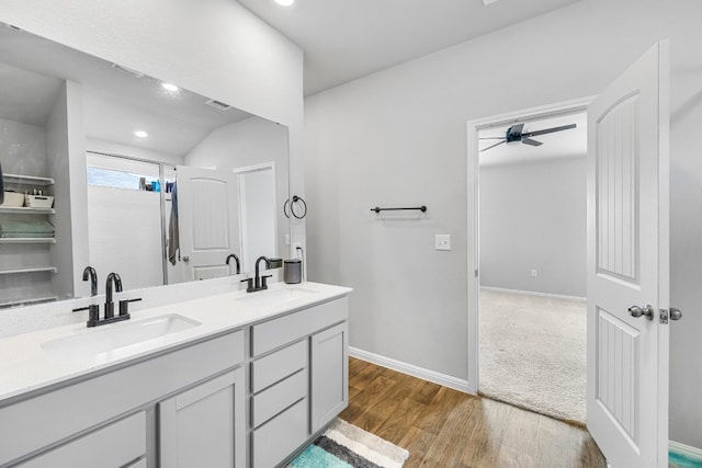 bathroom featuring vanity, hardwood / wood-style flooring, and ceiling fan