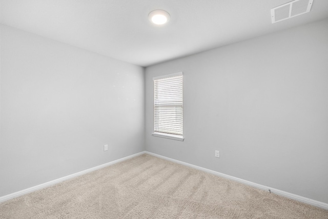 unfurnished room with carpet flooring