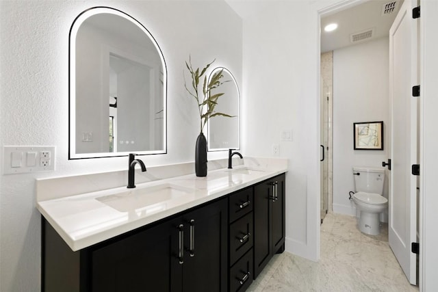 419 Hazeltine Dr, Lakeway, TX 78734 - bathroom featuring double vanity and marble look tiles