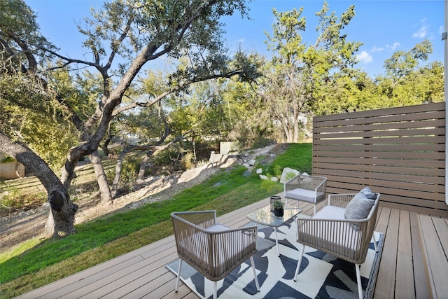 wooden terrace with an outdoor hangout area