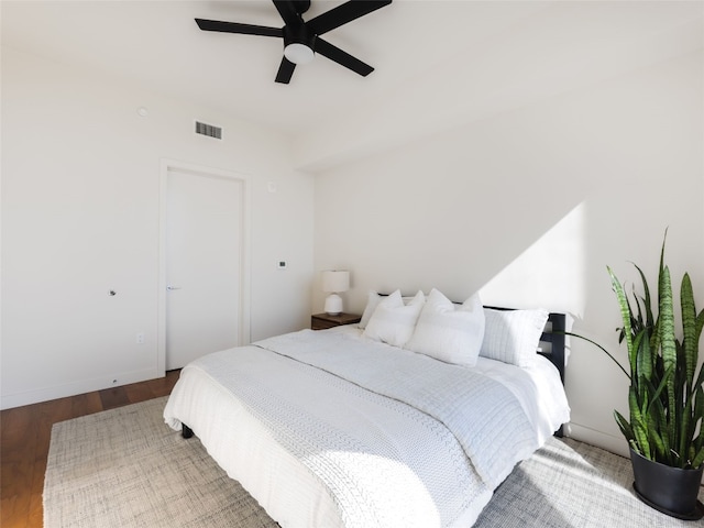 bedroom with hardwood / wood-style flooring and ceiling fan