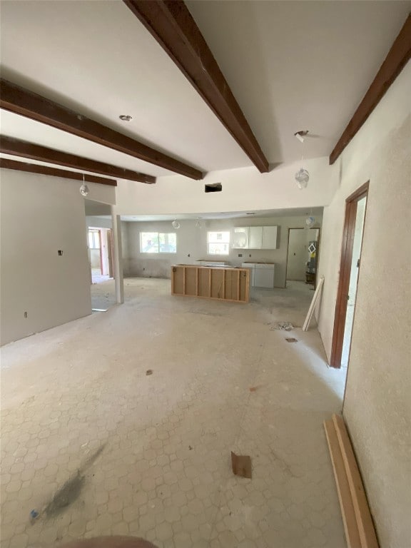 interior space featuring beamed ceiling