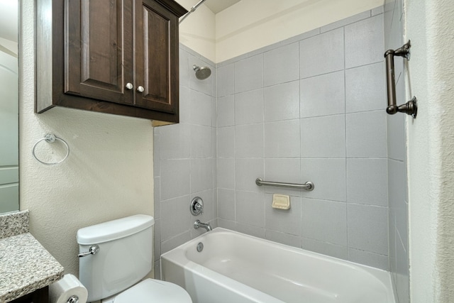 full bathroom featuring vanity, toilet, and tiled shower / bath