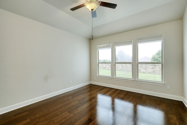 unfurnished room featuring ceiling fan and dark hardwood / wood-style flooring