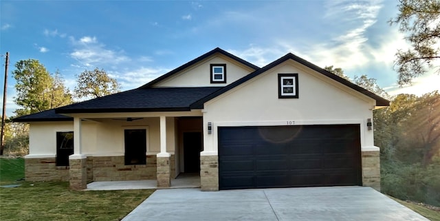 view of front of home with covered porch and a garage