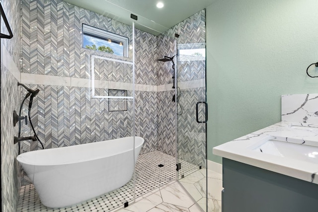 bathroom featuring vanity and separate shower and tub